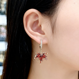 Златни обеци с листа и цирконий